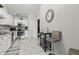 Bright kitchen features white cabinets, stainless steel appliances, and a cozy breakfast nook at 608 Fisher Creek Dr, Indianapolis, IN 46239