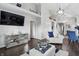 A stylish living area with a sleek TV console and elegant decor complements the open floor plan at 608 Fisher Creek Dr, Indianapolis, IN 46239