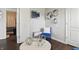 Stylish living room with decorative mirrors, blue accent chair, and sleek decor at 608 Fisher Creek Dr, Indianapolis, IN 46239