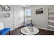 Cozy living room area with modern decor, round mirrors, and a comfy blue chair at 608 Fisher Creek Dr, Indianapolis, IN 46239