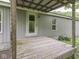 Wooden back porch and the exterior wall of the home with two windows at 6091 Mt Moriah Rd, Nineveh, IN 46164