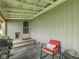Covered back porch with a chair and grill at 6091 Mt Moriah Rd, Nineveh, IN 46164