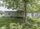 Charming backyard with grassy lawn and mature tree that offers some shade at 6091 Mt Moriah Rd, Nineveh, IN 46164
