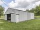 Spacious barn with sliding door, offering ample space for storage and projects at 6091 Mt Moriah Rd, Nineveh, IN 46164