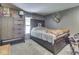 Cozy bedroom features a comfortable bed, rustic wood furniture, and a mounted deer head, creating a unique, lodge-like feel at 6091 Mt Moriah Rd, Nineveh, IN 46164
