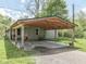 Close-up of a house with a spacious, covered carport, ideal for protecting vehicles from the elements at 6091 Mt Moriah Rd, Nineveh, IN 46164