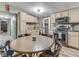 Eat-in kitchen featuring stainless steel appliances, wood countertops, and rustic wood backsplash at 6091 Mt Moriah Rd, Nineveh, IN 46164