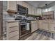 Eat-in kitchen featuring stainless steel appliances, wood countertops, and rustic wood backsplash at 6091 Mt Moriah Rd, Nineveh, IN 46164