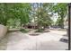 Sprawling backyard featuring mature trees, storage sheds, and ample parking at 6110 Orinoco Ave, Indianapolis, IN 46227