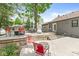 This backyard features a wooden deck with chairs, firepit and exterior view of home at 6110 Orinoco Ave, Indianapolis, IN 46227