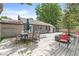 This backyard showcases a deck with a dining table set, fire pit, and house exterior at 6110 Orinoco Ave, Indianapolis, IN 46227