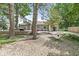 Backyard featuring mature trees, deck, and hammock, perfect for relaxing at 6110 Orinoco Ave, Indianapolis, IN 46227