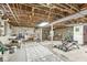 Spacious unfinished basement area with exposed ceiling and multiple recreational areas at 6110 Orinoco Ave, Indianapolis, IN 46227