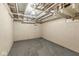 Unfinished basement with painted concrete walls and exposed ceiling at 6110 Orinoco Ave, Indianapolis, IN 46227