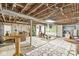 Unfinished basement area featuring exposed pipes, ceilings, and recreational areas at 6110 Orinoco Ave, Indianapolis, IN 46227