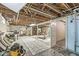 Unfinished basement with exposed ceiling and multiple potential areas for use at 6110 Orinoco Ave, Indianapolis, IN 46227