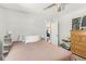 Cozy bedroom with light walls, comfortable bedding, and a ceiling fan at 6110 Orinoco Ave, Indianapolis, IN 46227