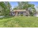 Charming home featuring a manicured lawn and inviting front entrance at 6110 Orinoco Ave, Indianapolis, IN 46227