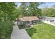 Beautifully landscaped yard surrounds this well-maintained home with mature trees at 6110 Orinoco Ave, Indianapolis, IN 46227