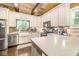 Bright kitchen with stainless steel appliances, ample counter space, and modern fixtures at 6110 Orinoco Ave, Indianapolis, IN 46227