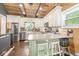 Spacious kitchen featuring stainless steel appliances, wooden ceilings, and a large island with seating at 6110 Orinoco Ave, Indianapolis, IN 46227