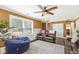 Bright living room with large windows, comfortable seating, and easy access to the kitchen at 6110 Orinoco Ave, Indianapolis, IN 46227