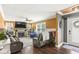 Spacious living room with a stone fireplace, large windows, and comfortable seating at 6110 Orinoco Ave, Indianapolis, IN 46227