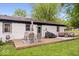 Well-maintained backyard featuring a patio area with seating and a grill at 620 Meadows Dr, Mooresville, IN 46158
