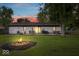 Spacious backyard featuring a fire pit, deck with furniture, grill, and mature trees at 620 Meadows Dr, Mooresville, IN 46158