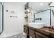 Modern bathroom features a black and white patterned floor and sliding barn door vanity at 620 Meadows Dr, Mooresville, IN 46158