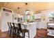 Contemporary kitchen with an island, bar seating, pendant lights, and stylish countertops at 620 Meadows Dr, Mooresville, IN 46158