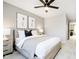 Bedroom with a plush bed, two nightstands and a ceiling fan at 6421 Springtide Ct, Plainfield, IN 46168