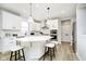 Bright kitchen featuring white cabinets, stainless steel appliances, and an island with pendant lighting at 6421 Springtide Ct, Plainfield, IN 46168