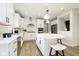 Modern kitchen with white cabinetry, stainless steel appliances, and a central island with seating at 6421 Springtide Ct, Plainfield, IN 46168