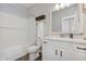 Modern bathroom with white vanity, quartz countertop, framed mirror, and a shower-tub combination with white subway tiles at 6465 Wasco Dr, Whitestown, IN 46075