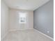 This empty bedroom features neutral walls and carpet and great natural light at 6465 Wasco Dr, Whitestown, IN 46075