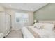 Bright bedroom featuring a bed, wardrobe, and well-lit windows with neutral decor at 6465 Wasco Dr, Whitestown, IN 46075