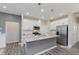 Modern kitchen featuring white cabinets, a large island, and stainless steel appliances at 6465 Wasco Dr, Whitestown, IN 46075