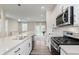 New kitchen boasts quartz countertops, stainless steel appliances, and an open design at 6465 Wasco Dr, Whitestown, IN 46075