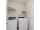 Well-organized laundry room with modern washer and dryer, complemented by ample storage space and functional design at 6465 Wasco Dr, Whitestown, IN 46075