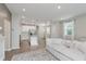 Open concept living area that connects to a modern kitchen and has stylish wood floors at 6465 Wasco Dr, Whitestown, IN 46075