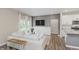 Comfortable living space featuring a gray accent wall, entertainment area, and easy kitchen access at 6465 Wasco Dr, Whitestown, IN 46075
