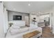 Spacious living room with a modern kitchen featuring stainless steel appliances and a center island at 6465 Wasco Dr, Whitestown, IN 46075