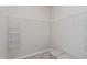 This walk-in closet has ample wire shelving and neutral-colored storage bins at 6465 Wasco Dr, Whitestown, IN 46075