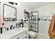 Modern bathroom with sleek fixtures, stylish mirror, and clean white tiles at 6556 Wandering Way, Indianapolis, IN 46241