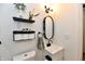 Well-lit bathroom featuring modern fixtures, and a sleek, minimalist design at 6556 Wandering Way, Indianapolis, IN 46241