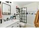 Modern bathroom with sleek fixtures, stylish mirror, and clean white tiles at 6556 Wandering Way, Indianapolis, IN 46241