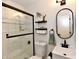 Well-lit bathroom with modern fixtures, a glass-enclosed shower, and stylish decor at 6556 Wandering Way, Indianapolis, IN 46241