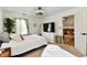 Bright bedroom with stylish ceiling fan and carpet, showcasing a comfortable and inviting space at 6556 Wandering Way, Indianapolis, IN 46241