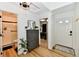 Open entryway featuring wood floors, white walls, a dresser with mirror, and multiple entry points at 6556 Wandering Way, Indianapolis, IN 46241